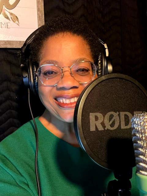 Voice actor Renee Garner Elms behind the mic in her at-home recording 